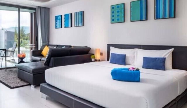 Modern Studio Condo with access to gym and infinity pools.