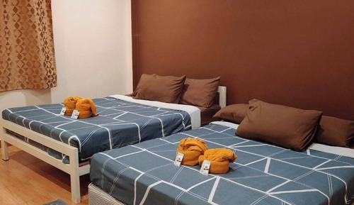 Deluxe Quadruple Room, 2 Queen Beds, Garden View