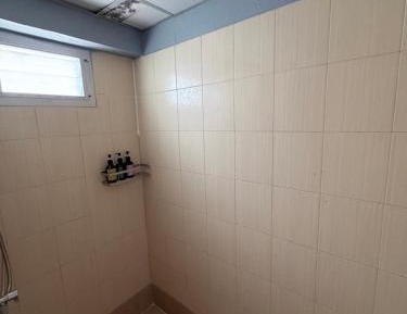 Single Bed in Dormitory Room