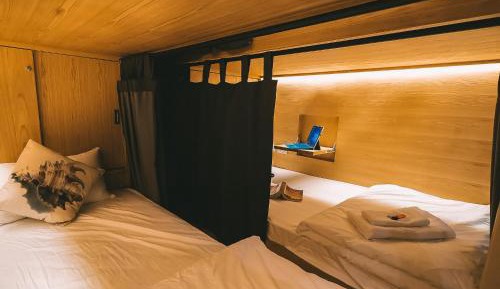 Bed in 6-Bed Female Dormitory Room with Shared Bathroom