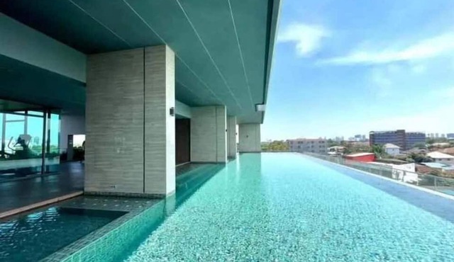 Modern 1-bedroom condo for up to 2 guests at Amber by Ester Star. Includes a separate bedroom, living area, kitchen, dining space, washing machine, balcony, city view and access to pool, gym, co-working space and shared building amenities.